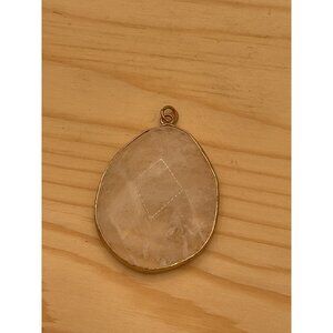 Clear Quartz Crystal Pendant Set In A Gold Colored Frame